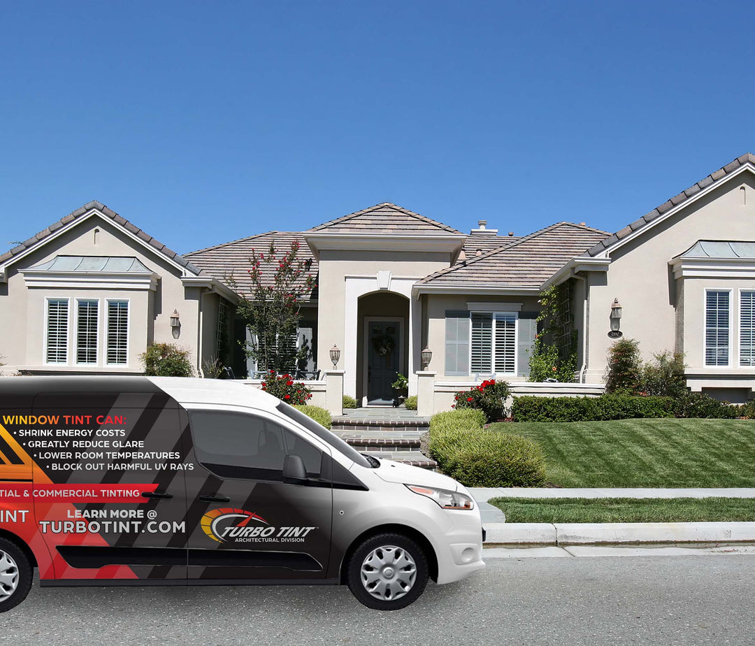 Turbo Tint mobile van in front of a house